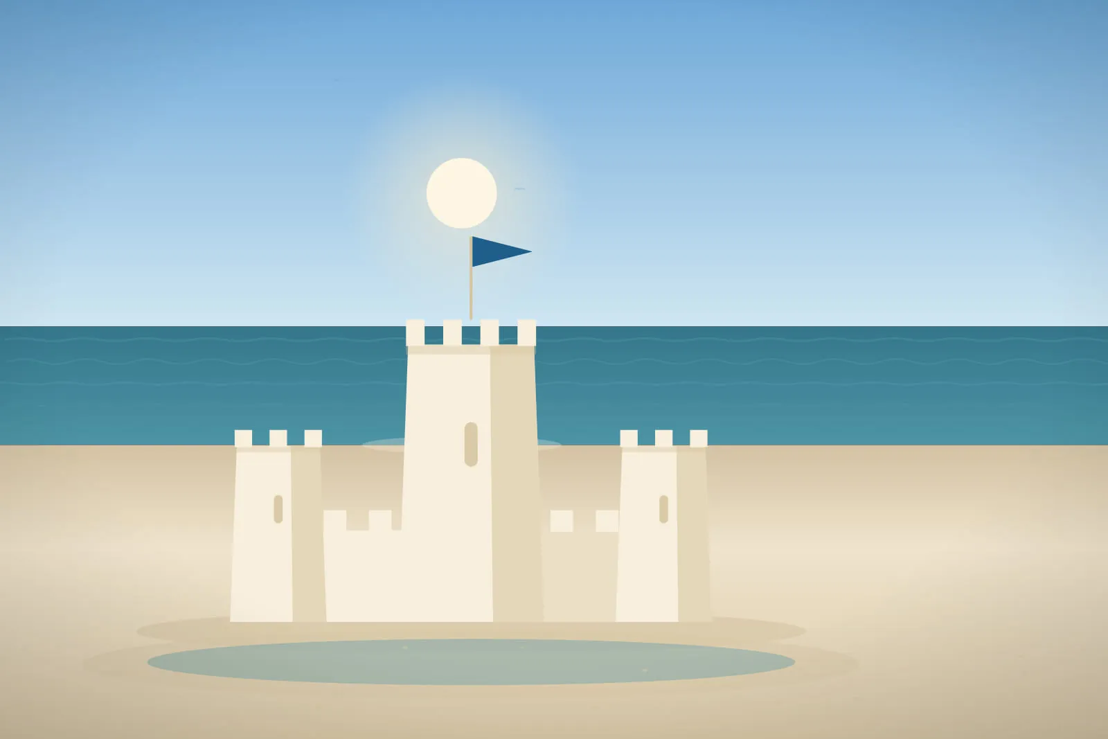 A wide daylight view of a sandcastle with a tall central keep, bright sky, deep blue-green sea and clean pale sand in the foreground.
